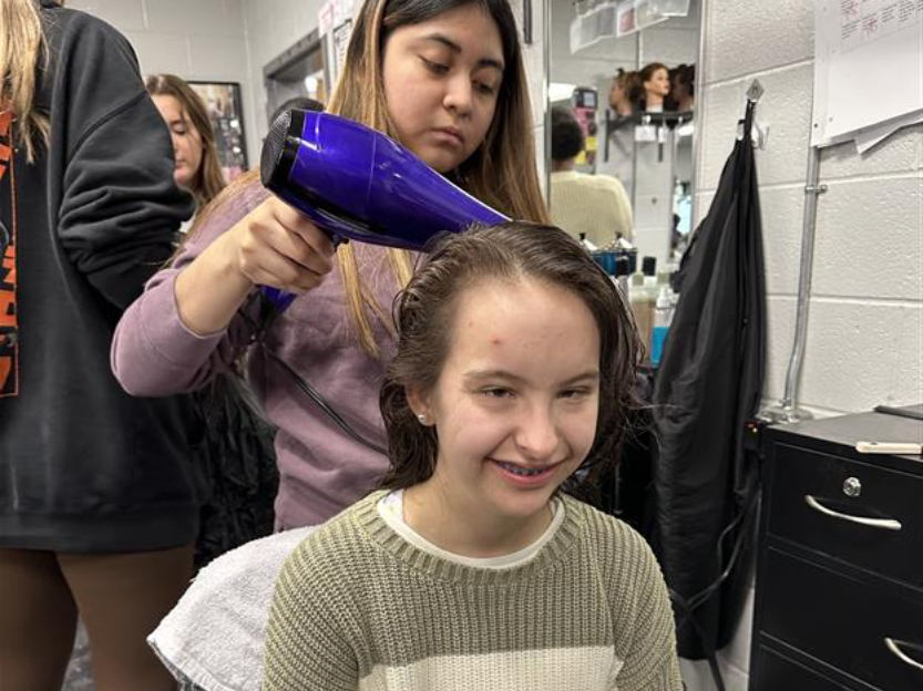 Centennial High cosmetology students style hair